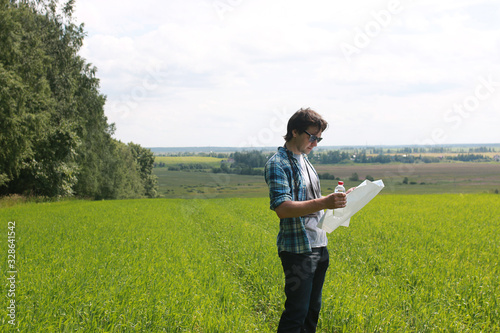 A young man looks at a map