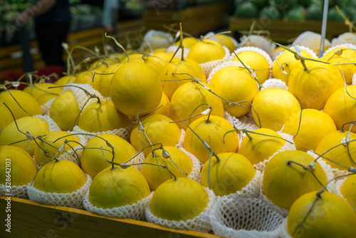 Fresh healthy fruits on shelves in supermarket