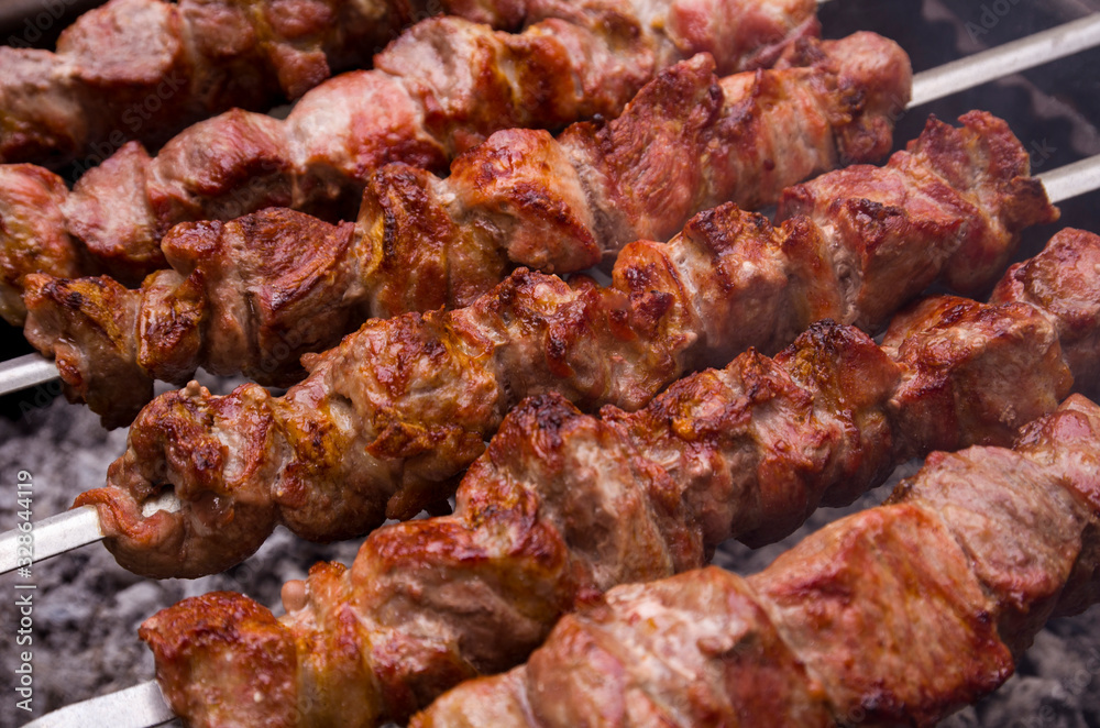 Grilled barbecue skewers of meat pieces