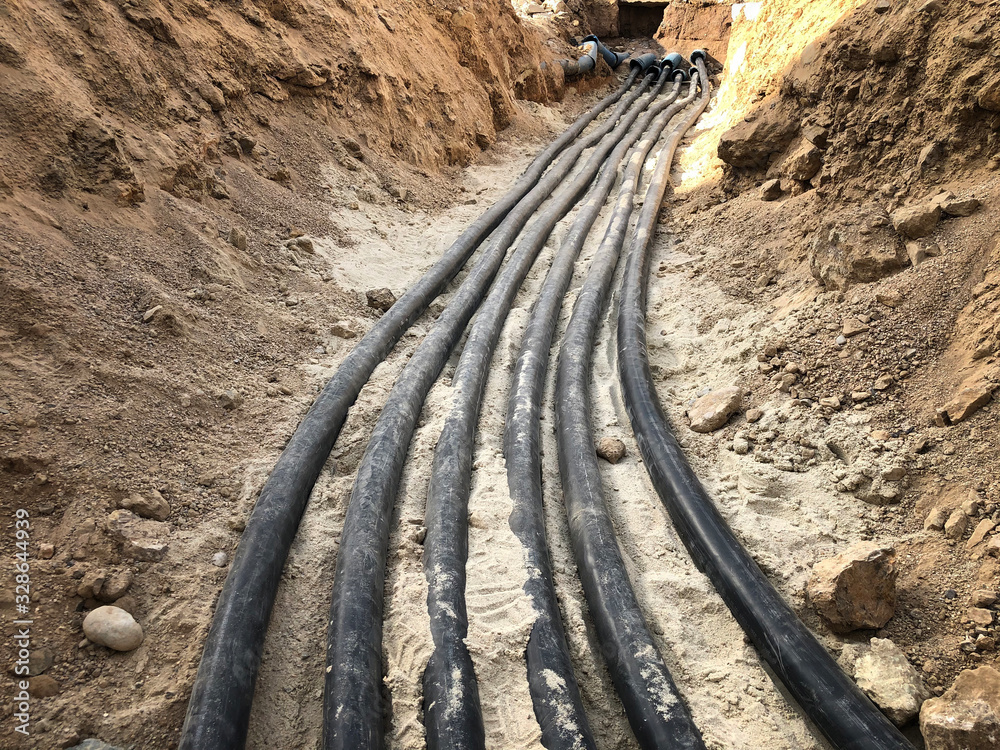 The high voltage electrical cable is laid in a trench ภาพถ่ายสต็อก ...
