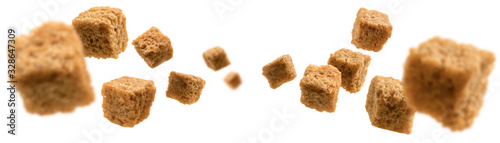 Bread croutons levitate on a white background photo