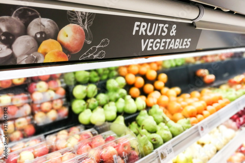 Fotografija Fruits and Vegetable signage at supermarket with defocused background