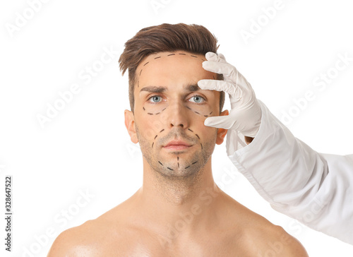 Plastic surgeon touching fa...