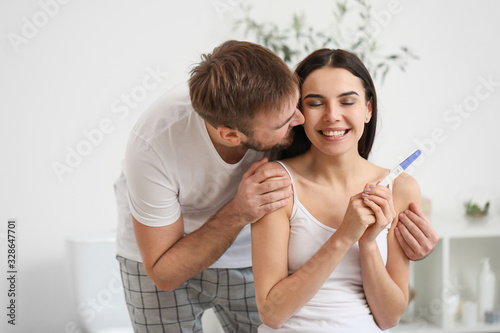 Happy young couple with pre...