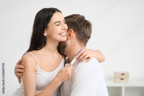 Happy young couple with pre...