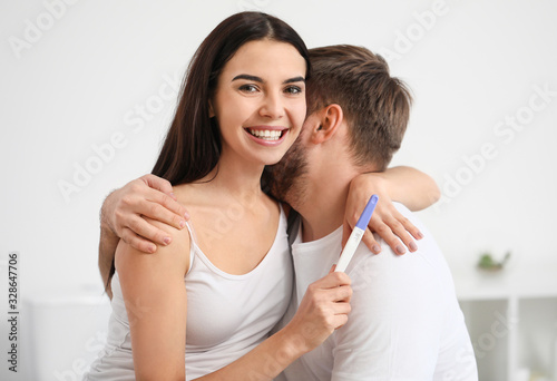 Happy young couple with pre...