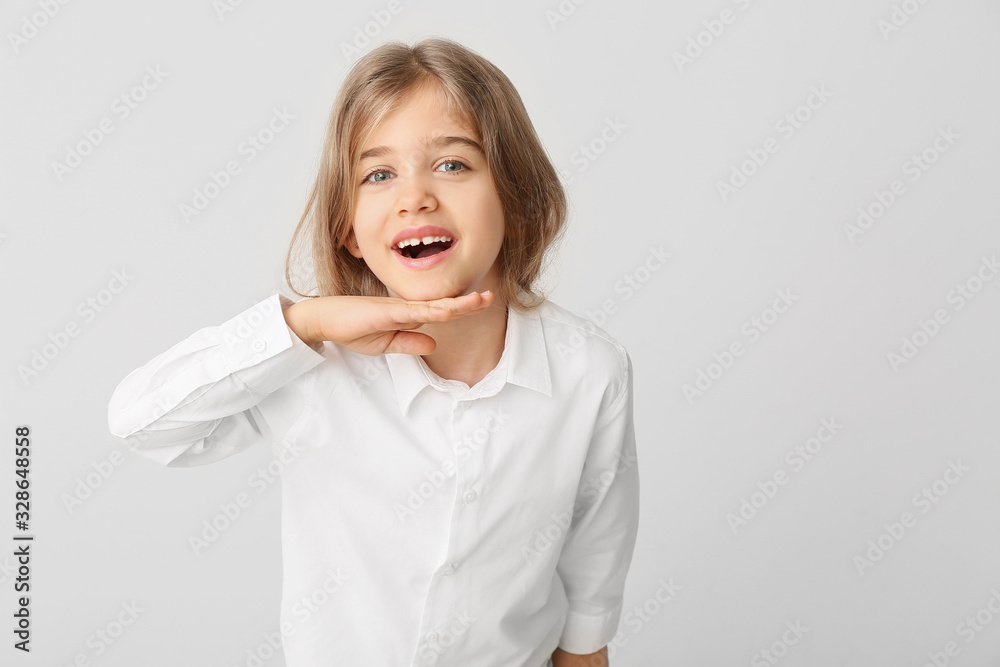 Happy little girl with healthy teeth on light background Happy little girl with healthy teeth on light background