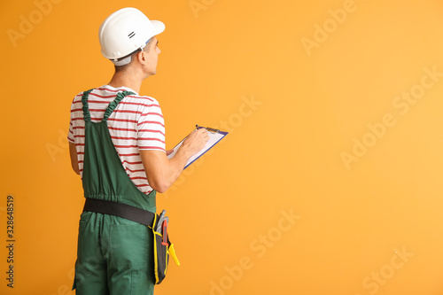 Handsome male worker with c...