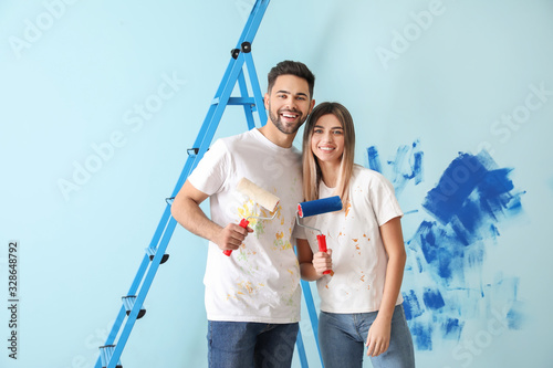 Happy young couple doing re...