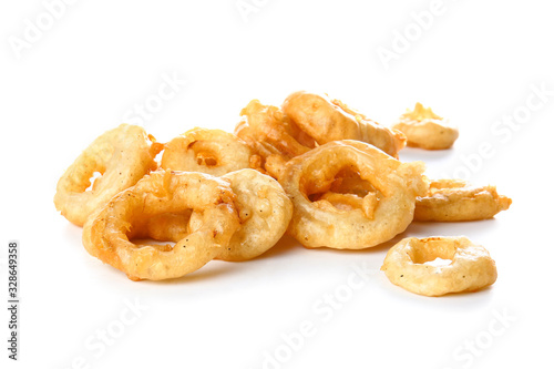 Crispy fried onion rings on white background