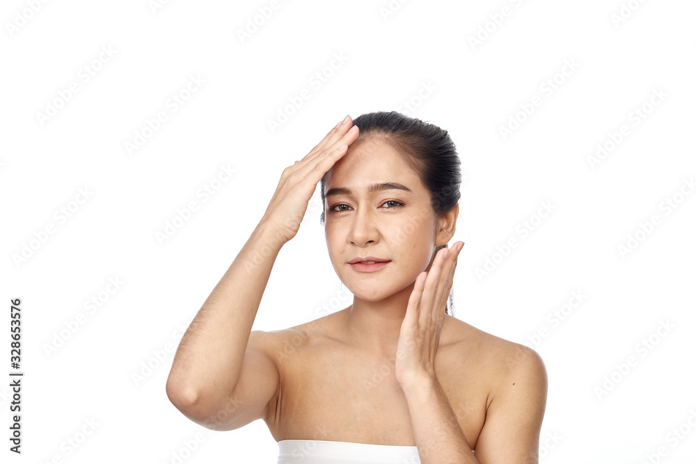 Beautiful young asian woman touching face Beautiful young asian woman touching face