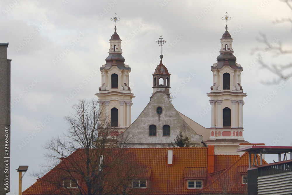 Church towers over roof in Vilnius city