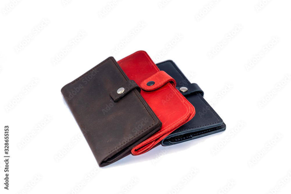 Set of hand made leather man wallet . Multi colored. Leather craft on white background. Set of hand made leather man wallet . Multi colored. Leather craft on white background.