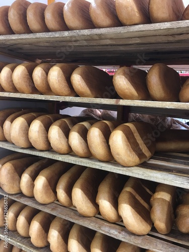 many loaves on a wooden trolley