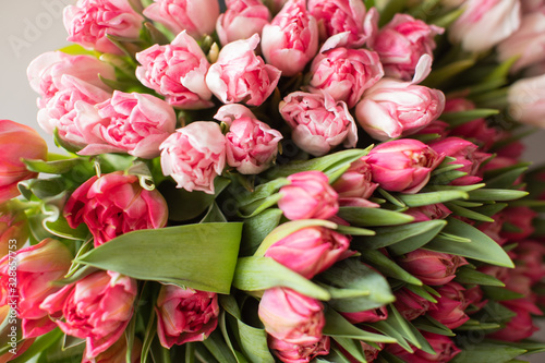 Close-up Large Beautiful bouquet of mixed tulips. Flower background and Wallpaper. Floral shop concept . Beautiful fresh cut bouquet. Flowers delivery