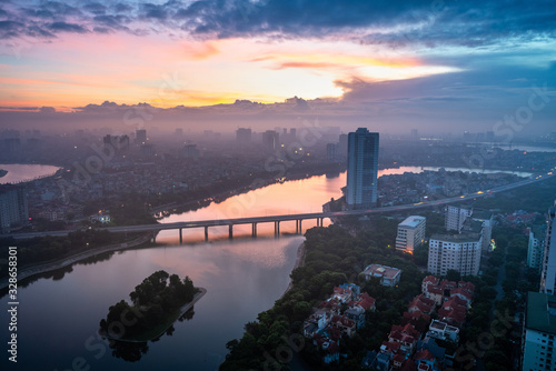 Aerial skyline view of Hanoi city, Vietnam. Hanoi cityscape by sunrise period at Linh Dam lake, Hoang Mai district