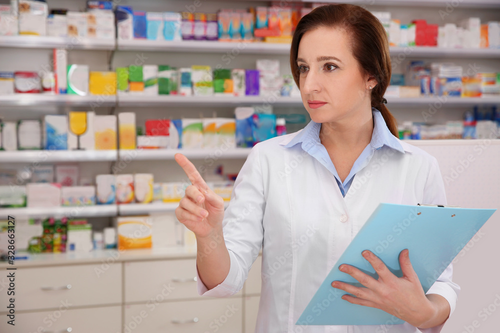 Professional pharmacist with clipboard in modern drugstore