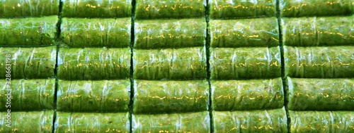 Delicious Turkish sweet,  wrapped green pistachio nuts  (  Fistik Sarma ) photo