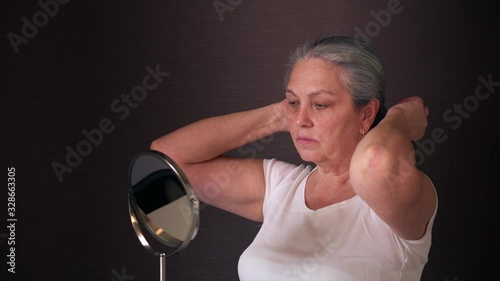 Lady woman fixing hair getting ready at home. Morning preparation