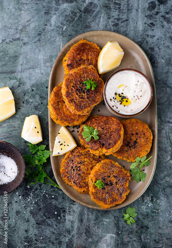 Vegetarian food. Vegetable cutlet from carrot  zucchini  potato with sauce.