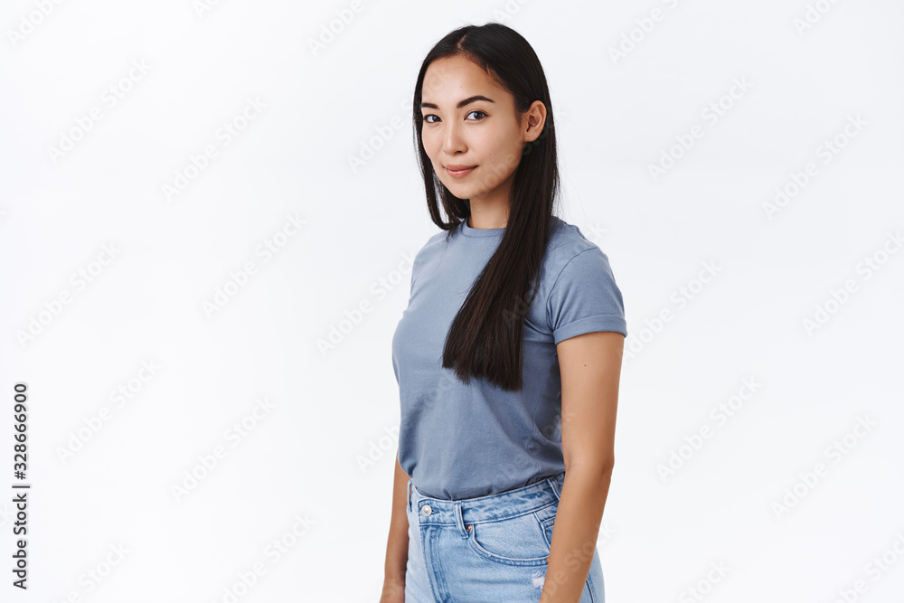 Portrait of confident woman with black hair wearing white t-shirt stock  photo