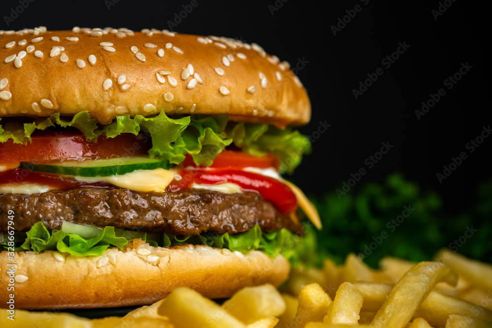 Juicy beef burger with cutlet, onion, vegetables.Isolated hamburger Juicy beef burger with cutlet, onion, vegetables.Isolated hamburger