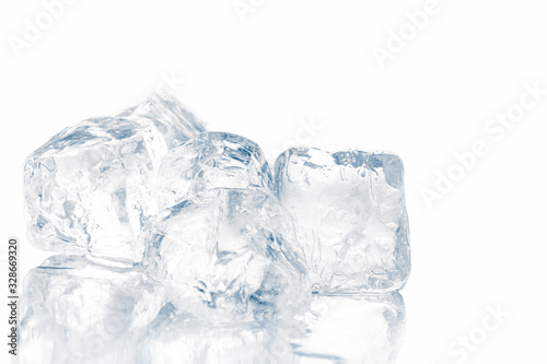 Natural crystal clear melting single ice cubes on white background.