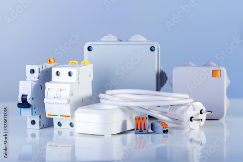 Different electrical equipment on blue background.  Various electric products on the store shelve. photo