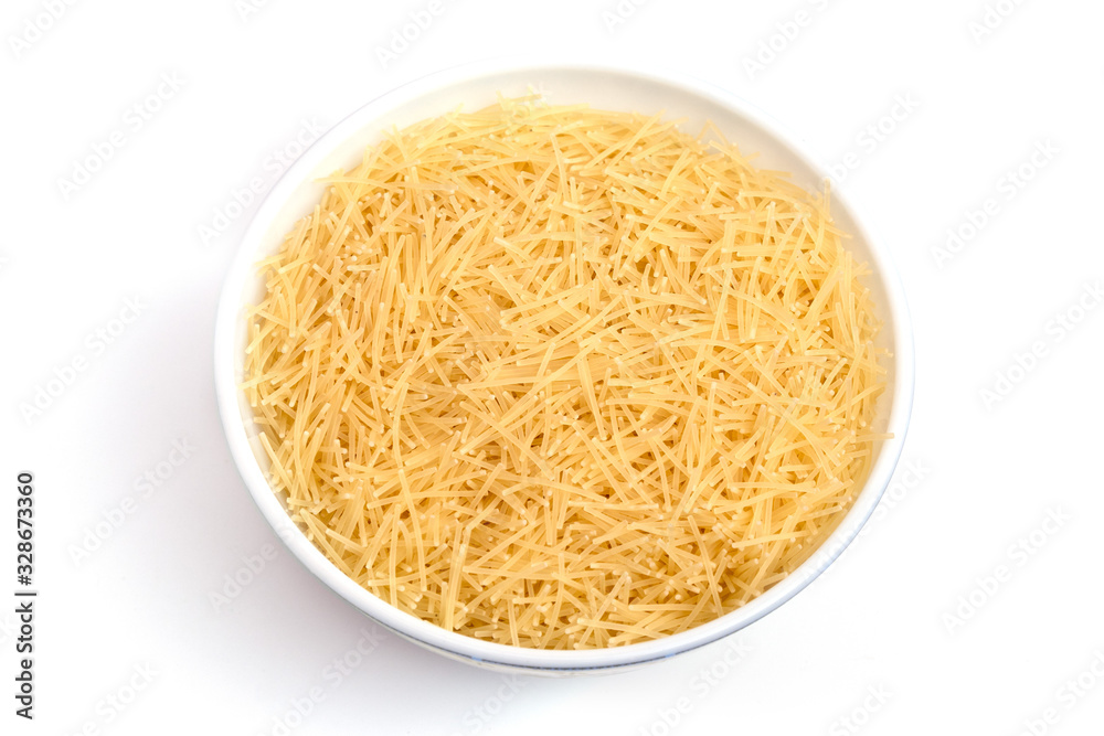 Vermicelli pasta in a wood bowl. white background Vermicelli pasta in a wood bowl. white background