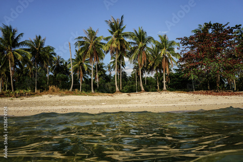palm trees on a lonely beach on Koh Jum in Thailand 2019