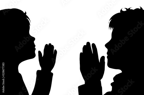 Vector silhouette of anonymous children who pray on white background. Symbol of people and religion.