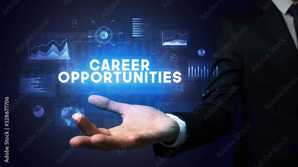Hand of Businessman holding CAREER OPPORTUNITIES inscription, business success concept Hand of Businessman holding CAREER OPPORTUNITIES inscription, business success concept