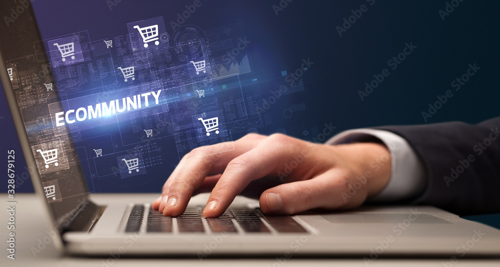 Businessman working on laptop with ECOMMUNITY inscription, online shopping concept Businessman working on laptop with ECOMMUNITY inscription, online shopping concept