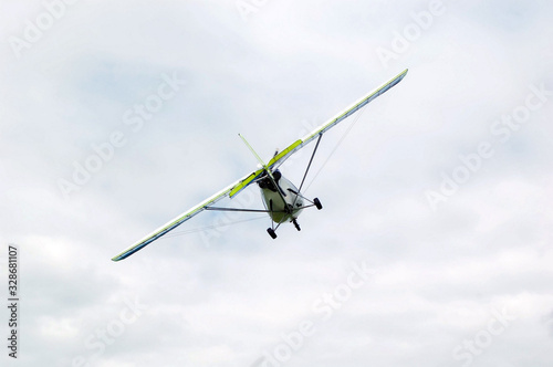Light-engine plane flies at low altitude