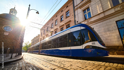 Tram on the street of old town in Krakow, Poland. Cityscape with polish public transport .