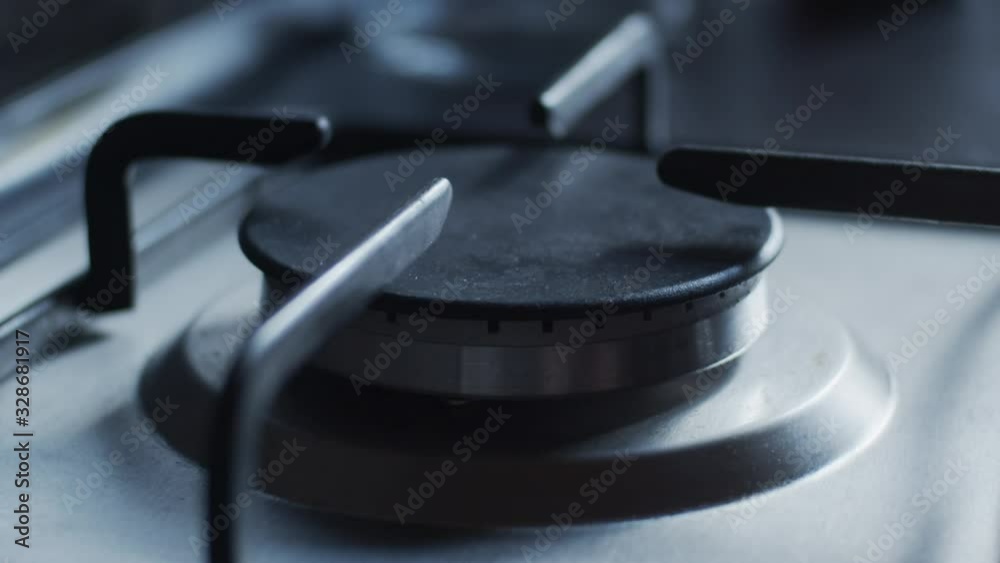Gas stove flame fades out, slow motion, shallow depth of field Gas stove flame fades out, slow motion, shallow depth of field