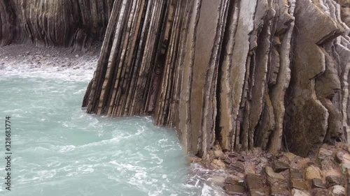 Coastal shot of Zumaia’s flysch where the rough seas and huge cliffs surround the scenery.