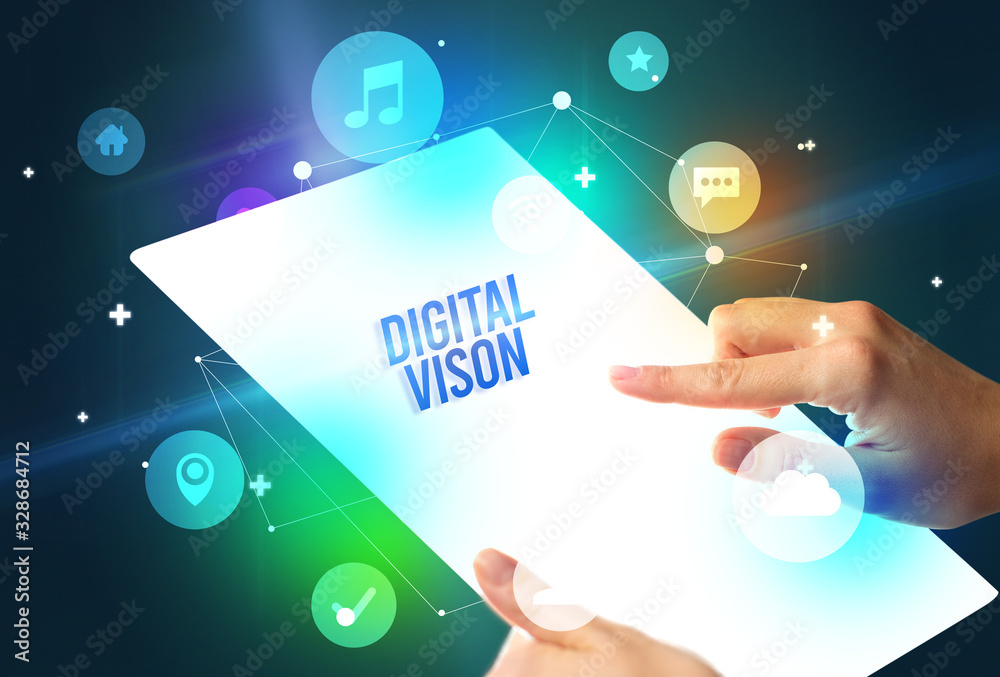 Holding futuristic tablet with DIGITAL VISON inscription, new technology concept Holding futuristic tablet with DIGITAL VISON inscription, new technology concept