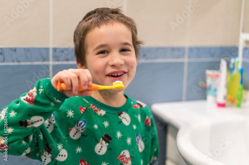 Close-up of young boy brushing teeth with toothbrush Portrait of healthy little boy enjoy cleaning his teeth with a happy face, Happy child brushing his little teeth in bath room, Dental concept