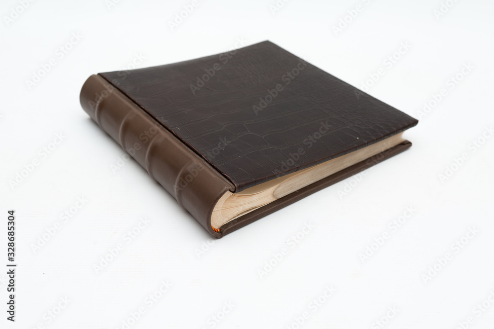 Leather brown photo album on a white background Leather brown photo album on a white background