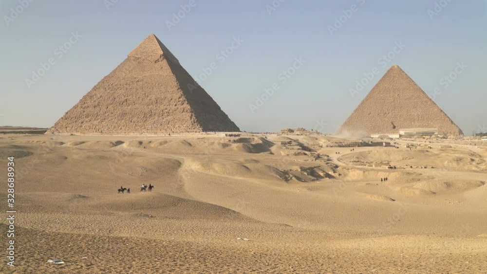 Panoramic view of Giza Pyramids, located on Giza Plateau one of the most visited touristic sites in Cairo, Egypt Panoramic view of Giza Pyramids, located on Giza Plateau one of the most visited touristic sites in Cairo, Egypt