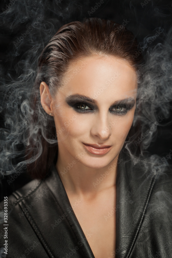 Closeup portrait of a serious lady with smoky eye makeup Closeup portrait of a serious lady with smoky eye makeup