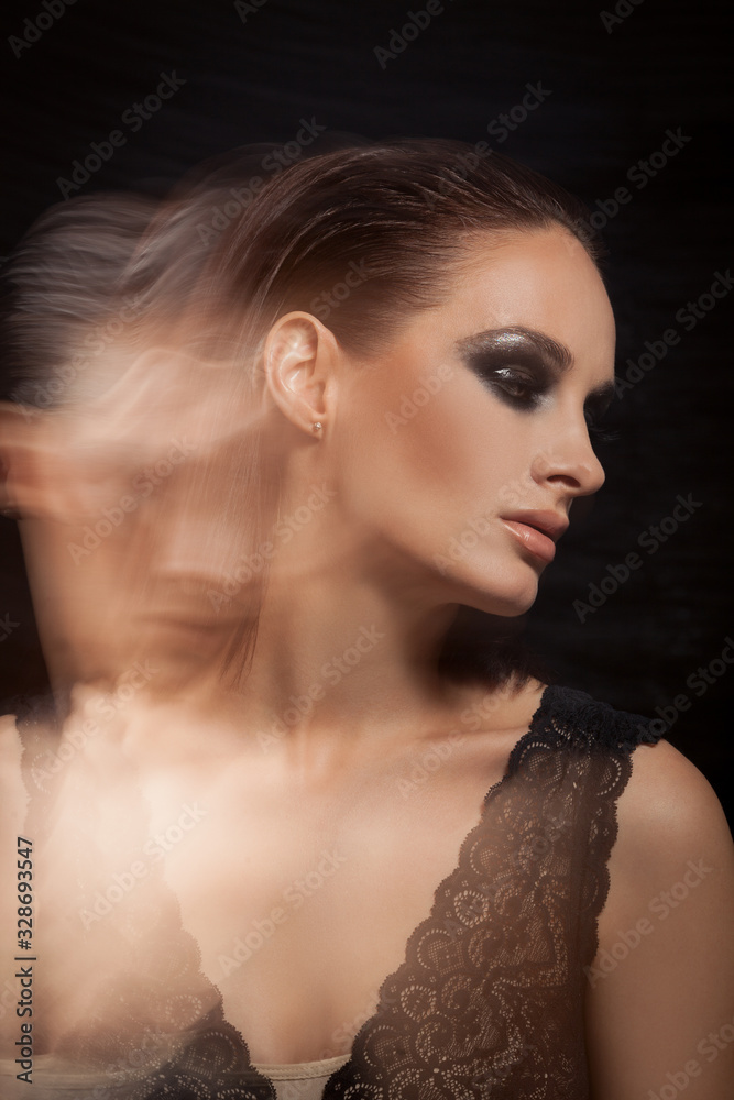 Closeup portrait of a serious lady with smoky eye makeup