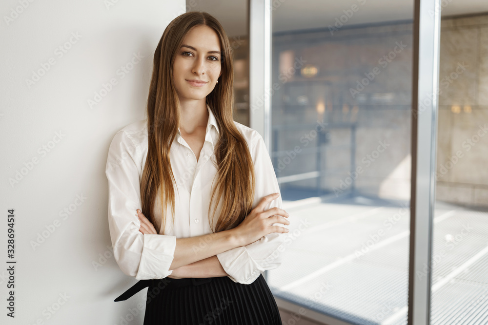 Youth, recruitment and business concept. Attractive satisfied young female entrepreneur, company employee manage projects, finished good deal, standing proud, smiling and cross hands confident Youth, recruitment and business concept. Attractive satisfied young female entrepreneur, company employee manage projects, finished good deal, standing proud, smiling and cross hands confident