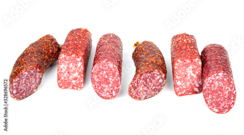 Smoked sausage in assortment on a white background