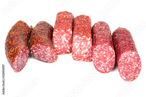 Smoked sausage in assortment on a white background