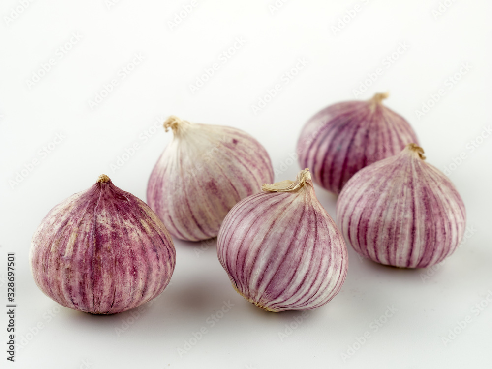 Fototapeta premium Fresh garlic on market table closeup photo