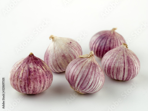 Fresh garlic on market table closeup photo
