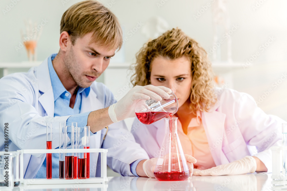 Scientists working in laboratory Scientists working in laboratory