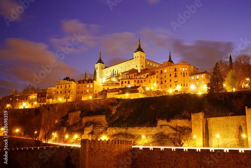 Toledo in Spain at night. Famous UNESCO World Heritage Site. The historic city in beautiful illumination after sunset.